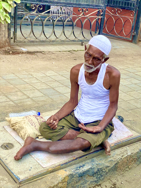 Beggar by the street