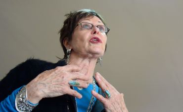 Dr. Jean Watson in mid-sentence.