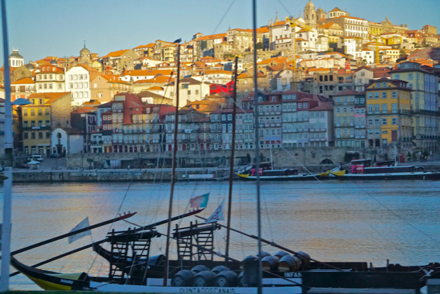 Porto panorama.  In the foreground, one of the historic replica boats used to carry barrels of wine into the city.