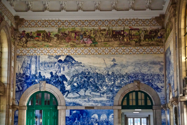 Decorative tiles within the Porto train station which illustrate the history of the city of Porto.