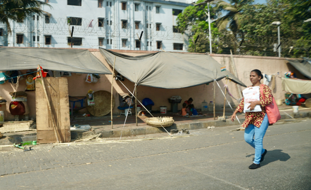 By day these families make baskets. At night they sleep by this wall.